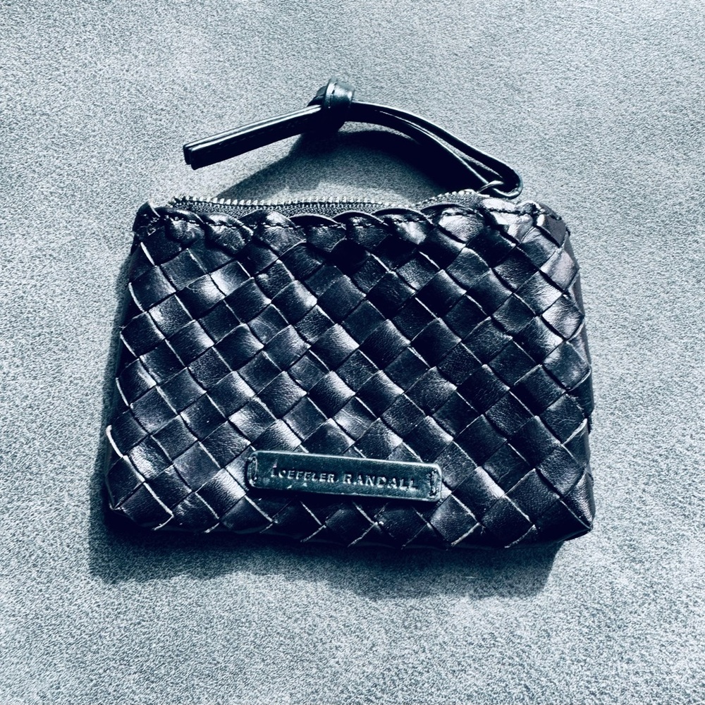 Loeffler Randall leather bag. NWT.
Zip closes. Black leather.